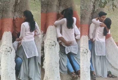College couple enjoys outdoor sex below a big tree